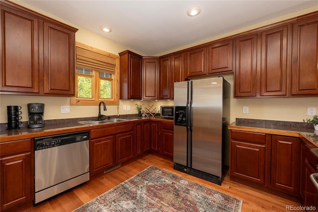 230 Buckhorn Cir, Granby, CO 80446 - kitchen featuring stainless steel appliances, a sink, light wood-style floors, and recessed lighting
