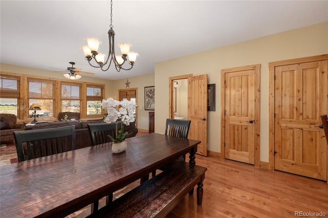 230 Buckhorn Cir, Granby, CO 80446 - dining space featuring a chandelier, a ceiling fan, light wood-style flooring, and baseboards