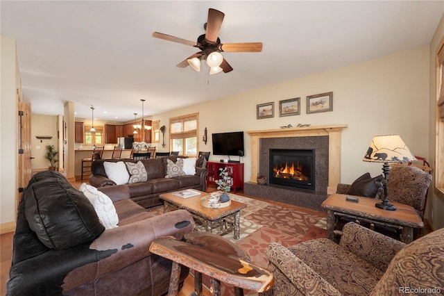 230 Buckhorn Cir, Granby, CO 80446 - living area with a ceiling fan, a tile fireplace, and wood finished floors