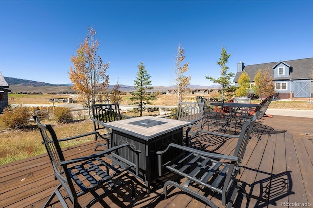 230 Buckhorn Cir, Granby, CO 80446 - wooden terrace featuring outdoor dining area and a mountain view