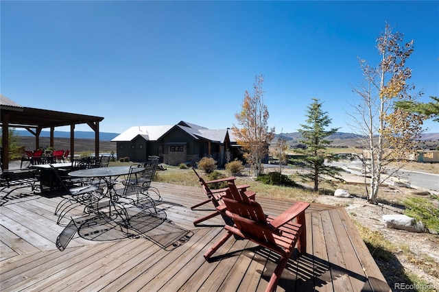 230 Buckhorn Cir, Granby, CO 80446 - wooden terrace featuring outdoor dining space and a mountain view