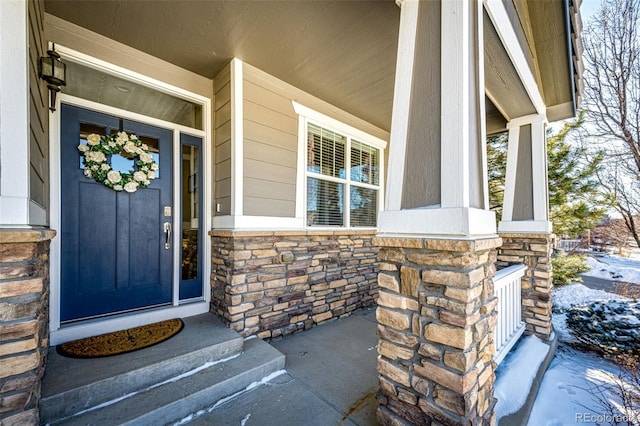 doorway to property with covered porch