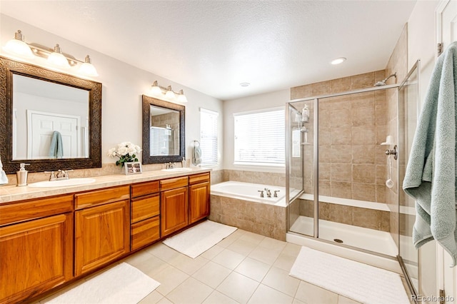 bathroom with vanity, separate shower and tub, and tile patterned flooring