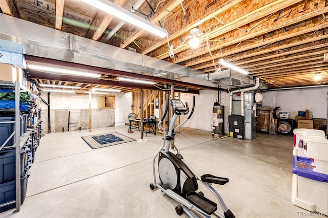 basement featuring water heater and heating unit