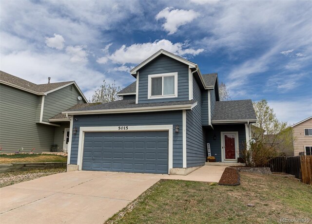 5015 Copen Dr, Colorado Springs, CO 80922 - traditional home with concrete driveway and a shingled roof