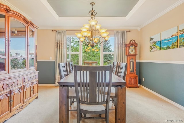 16071 Crestrock Cir, Parker, CO 80134 - dining room with a chandelier, light colored carpet, a tray ceiling, and crown molding