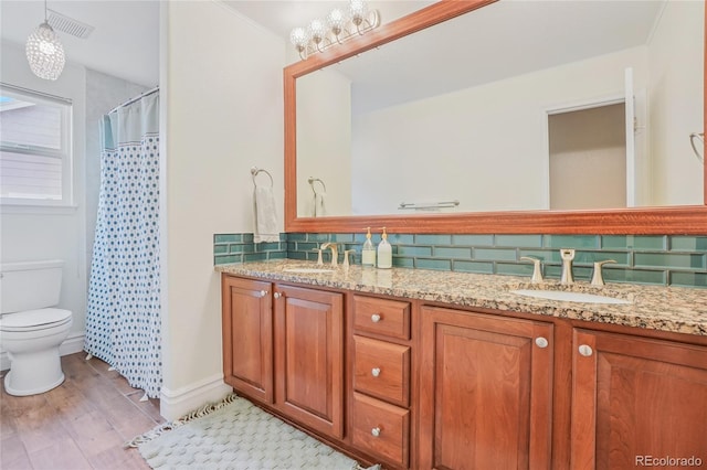 16071 Crestrock Cir, Parker, CO 80134 - bathroom with double vanity, backsplash, wood finished floors, and curtained shower