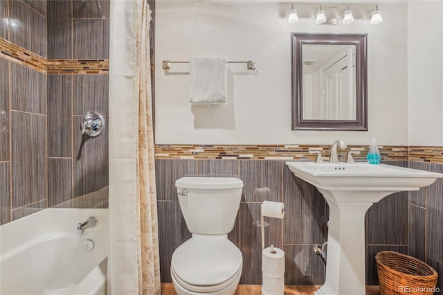 16071 Crestrock Cir, Parker, CO 80134 - full bath with tile walls, shower / bath combination with curtain, and wainscoting
