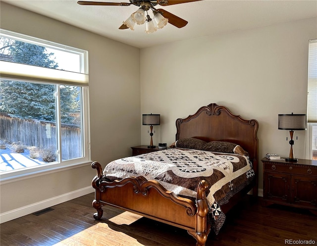 bedroom with dark wood-type flooring and ceiling fan