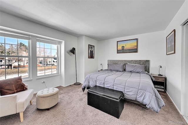 carpeted bedroom with baseboards