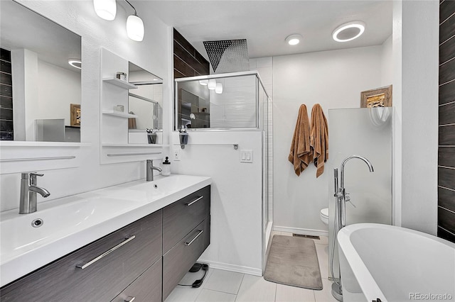 bathroom featuring double vanity, visible vents, toilet, a shower stall, and a sink