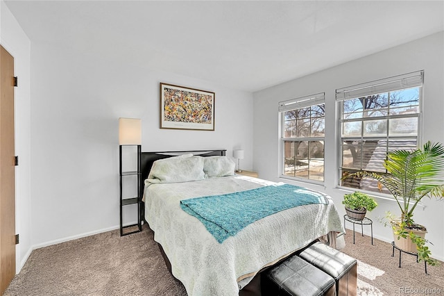 carpeted bedroom with baseboards