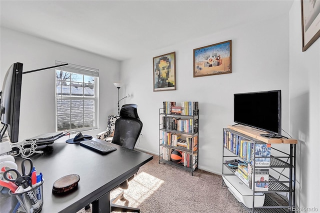 carpeted office featuring baseboards