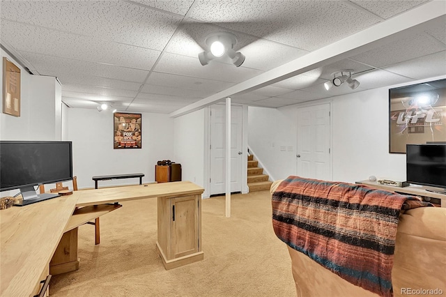 office space featuring a paneled ceiling and light colored carpet