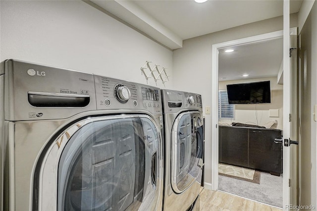 8754 Mesquite Row, Lone Tree, CO 80124 - washroom featuring washing machine and clothes dryer, recessed lighting, and wood finished floors