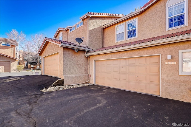 8754 Mesquite Row, Lone Tree, CO 80124 - garage with driveway
