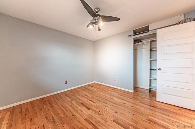 unfurnished bedroom featuring a closet, baseboards, ceiling fan, and light wood-style floors