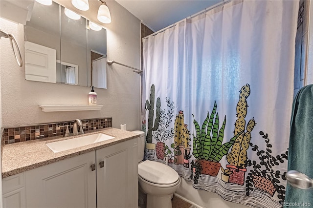 bathroom featuring toilet, tasteful backsplash, a textured wall, and vanity