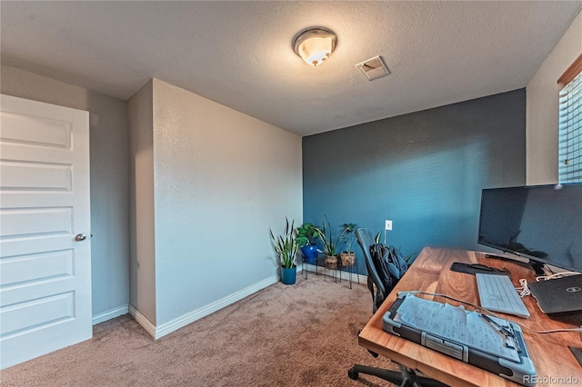 carpeted office featuring baseboards and visible vents