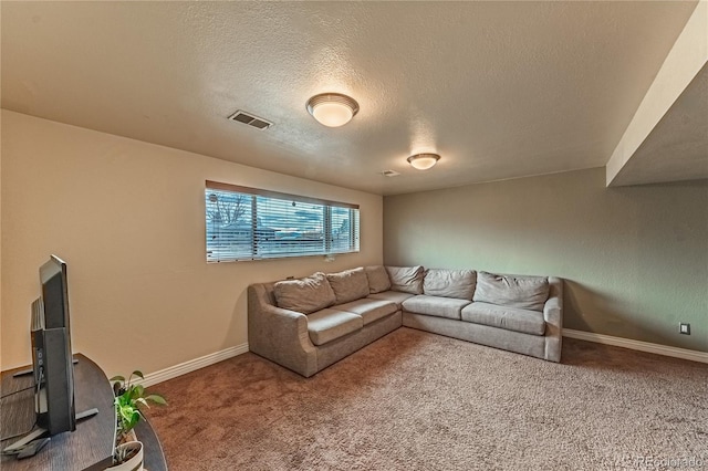 carpeted living room featuring visible vents, a textured ceiling, and baseboards