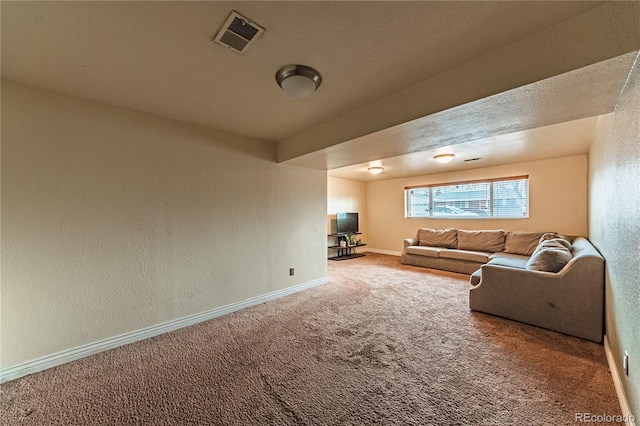 living room with visible vents, baseboards, a textured wall, and carpet floors