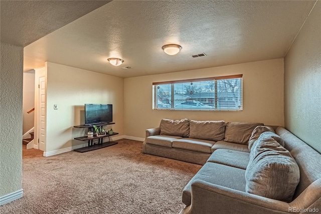 living room featuring visible vents, carpet flooring, stairs, and a textured ceiling