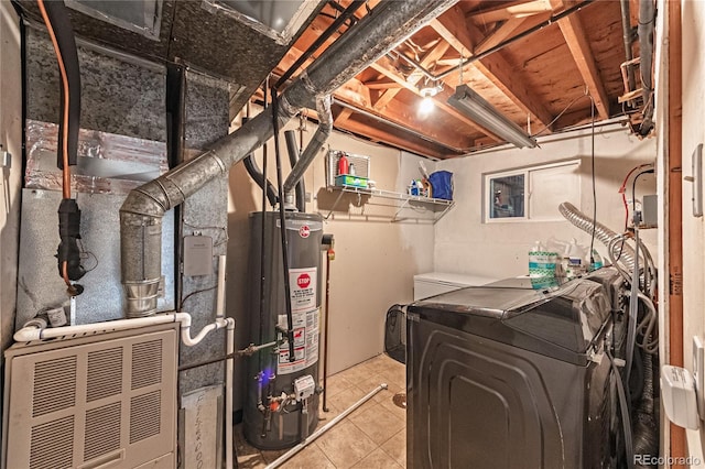 utility room featuring washing machine and clothes dryer and gas water heater