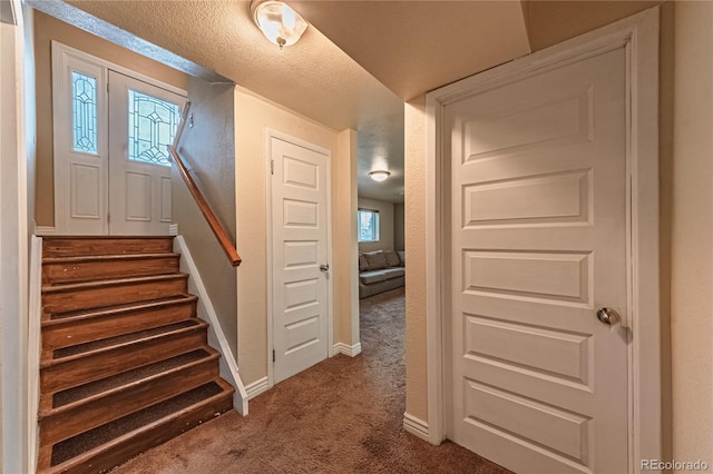 stairs with carpet floors and baseboards