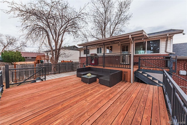 deck featuring outdoor lounge area and fence
