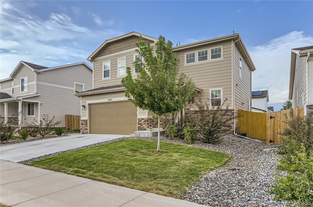 view of front of home featuring a garage and a front lawn