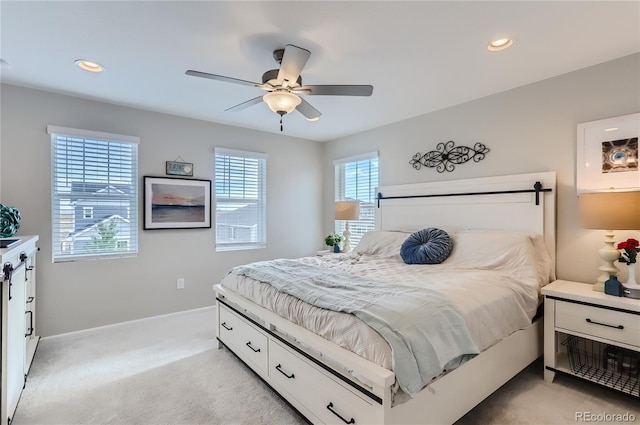 bedroom featuring light carpet and ceiling fan