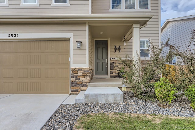 view of exterior entry featuring a garage