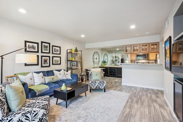 living room with light hardwood / wood-style flooring