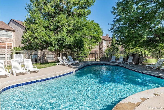 view of swimming pool featuring a patio