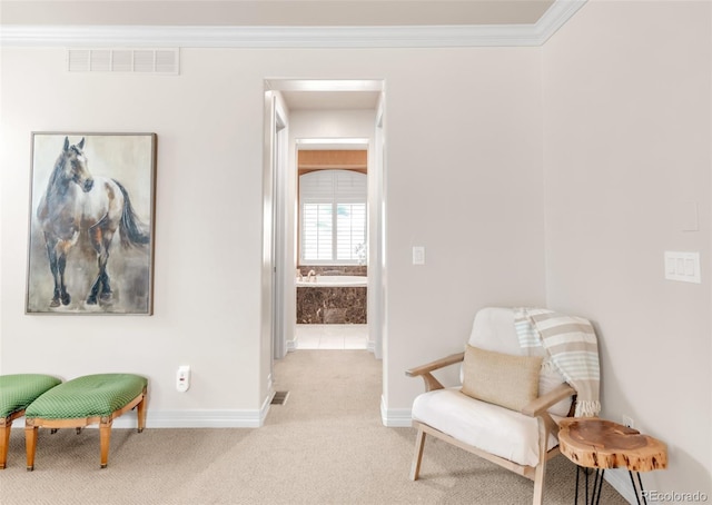 3143 Elmira St, Denver, CO 80238 - sitting room featuring baseboards, carpet, and crown molding