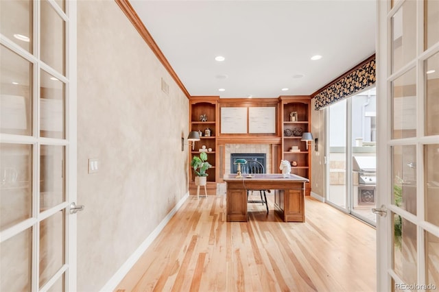 3143 Elmira St, Denver, CO 80238 - office featuring light wood-style flooring, french doors, a fireplace, recessed lighting, and baseboards