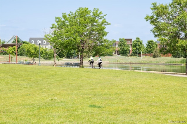 3143 Elmira St, Denver, CO 80238 - view of property's community featuring a lawn and a water view