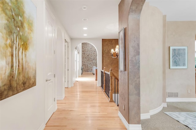 3143 Elmira St, Denver, CO 80238 - hallway with arched walkways, light wood-type flooring, baseboards, and recessed lighting