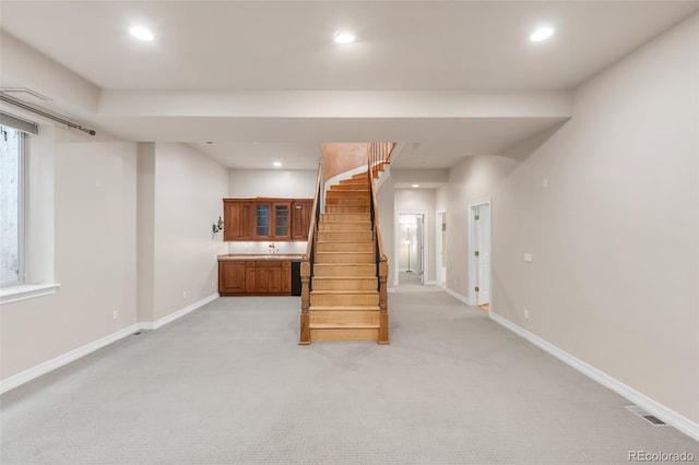 3143 Elmira St, Denver, CO 80238 - basement with light colored carpet, stairway, recessed lighting, baseboards, and a sink