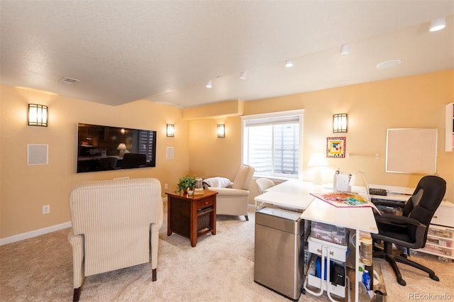 office with baseboards, a textured ceiling, visible vents, and light colored carpet