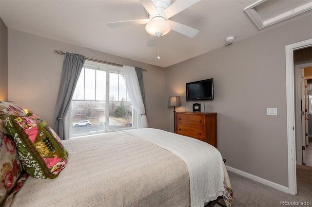 bedroom featuring carpet floors, a ceiling fan, attic access, and baseboards