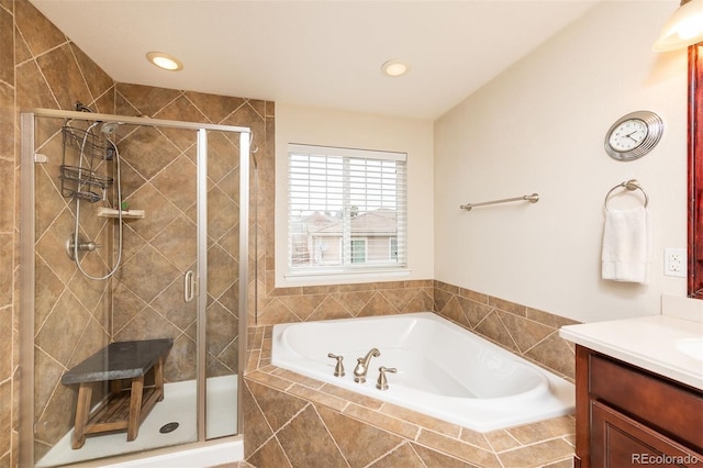 full bath with recessed lighting, vanity, a bath, and a shower stall