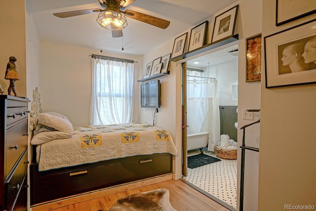 bedroom with ceiling fan and light hardwood / wood-style floors