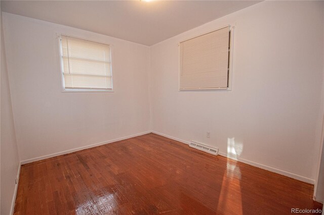 spare room featuring hardwood / wood-style floors