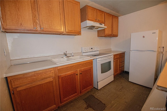 kitchen featuring white appliances and sink