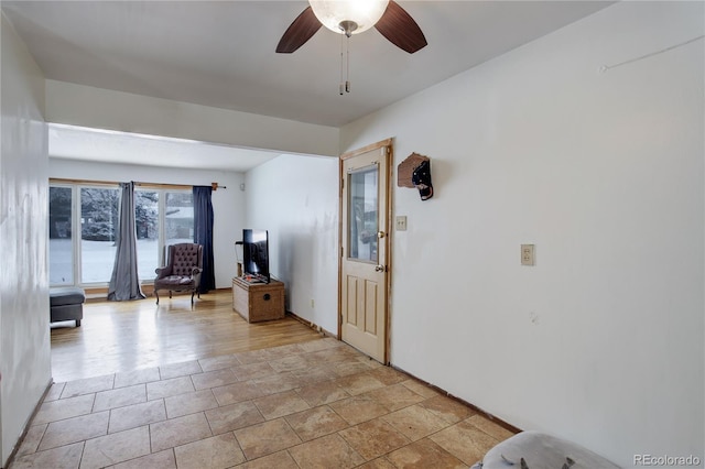 entrance foyer featuring ceiling fan