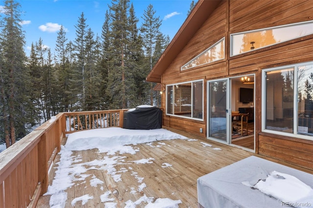 snow covered deck featuring grilling area