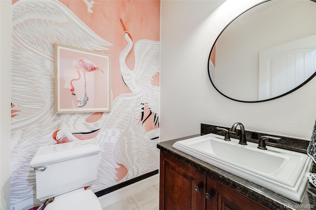 bathroom featuring vanity, tile patterned flooring, and toilet