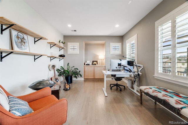 office area with baseboards, recessed lighting, visible vents, and light wood-style floors