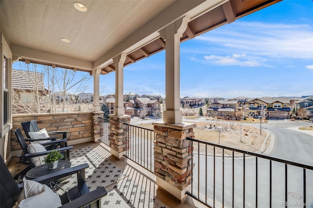 balcony featuring a residential view